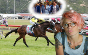 pink haired woman with horseracing in background and well dressed men in Wellington.