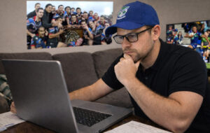 warriors fan looking at laptop
