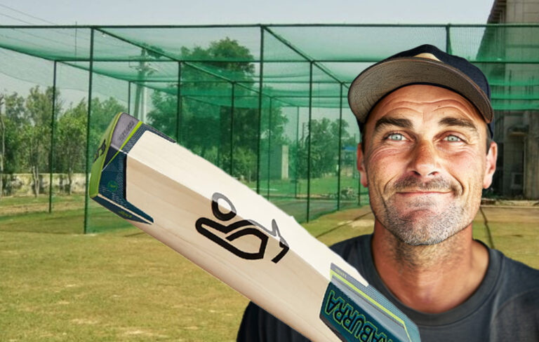 man with cricket bat at cricket nets