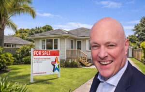 Luxon in front of property for sale