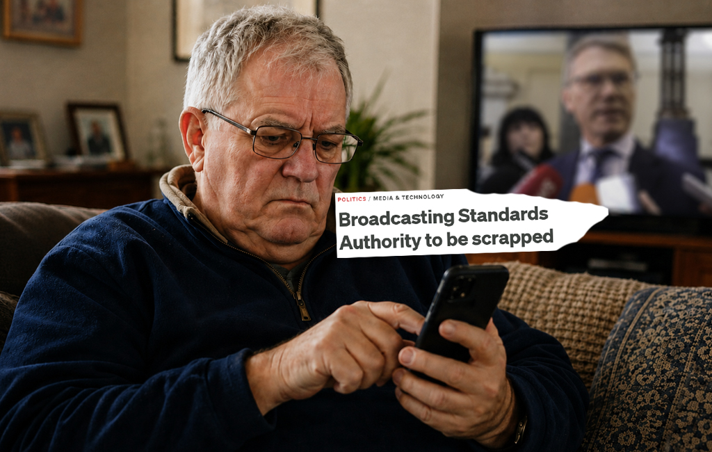 man looking at phone in lounge.