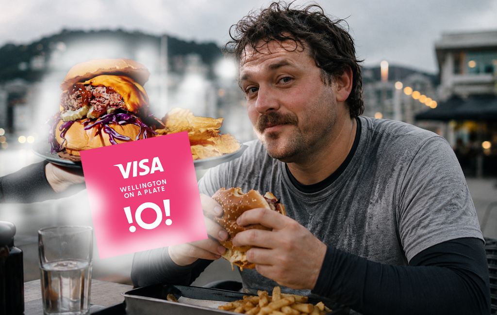 man eating burger while still sweating from a run.