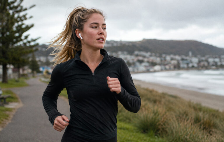 woman running by beach