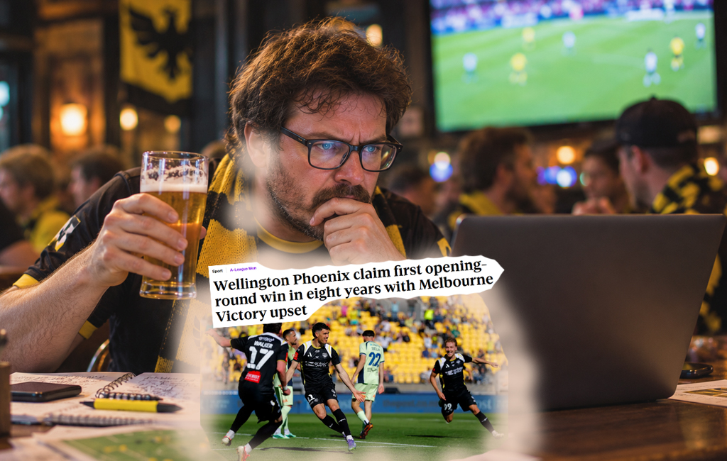 man on laptop with beer at pub